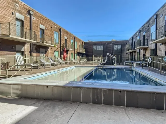 a view of a swimming pool with a lounge chairs