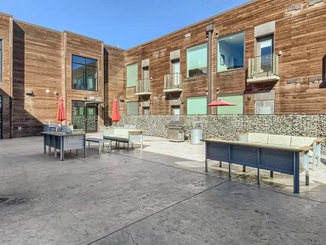 a view of a building with outdoor seating