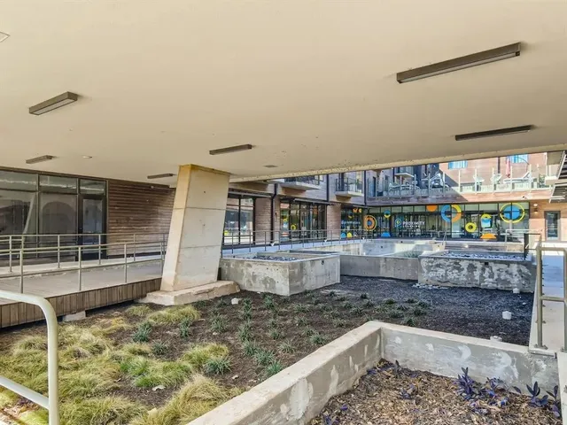 a kitchen with stainless steel appliances kitchen island granite countertop a sink and cabinets
