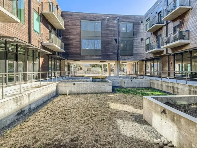 a view of a kitchen with a large window and a sink