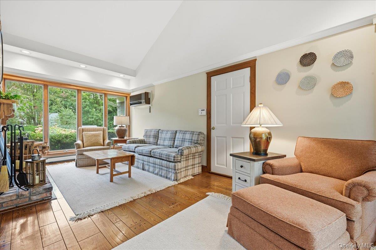 88 Luquer Road Manhasset, NY 11030 - Photo 14 of 38 a living room with furniture and a large window
