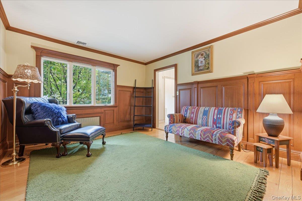 88 Luquer Road Manhasset, NY 11030 - Photo 16 of 38 a living room with furniture and a large window
