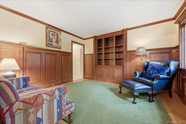 a living room with furniture and a rug
