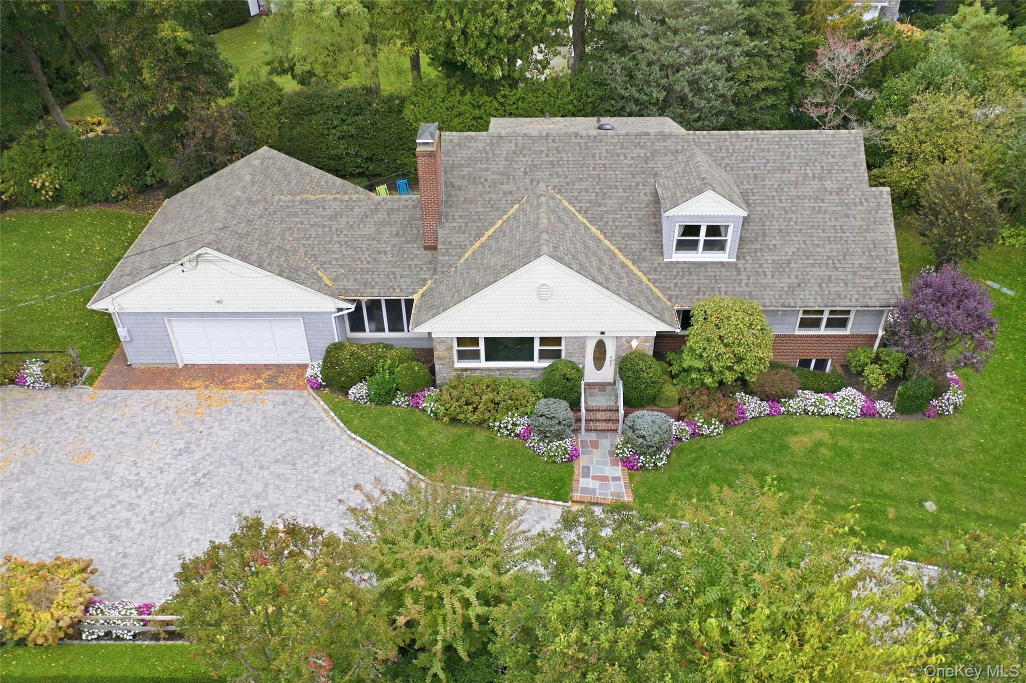 88 Luquer Road Manhasset, NY 11030 - Photo 4 of 38 a aerial view of a house