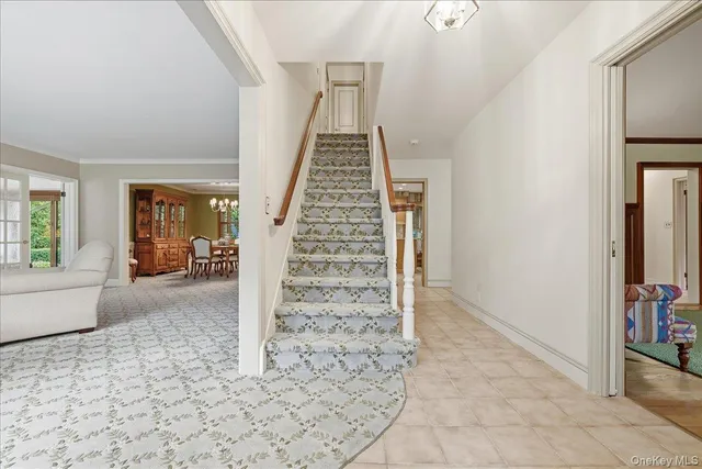 a view of an entryway with wooden floor and windows