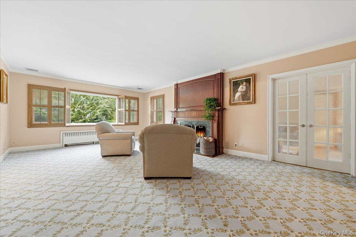 88 Luquer Road Manhasset, NY 11030 - Photo 7 of 38 a living room with furniture and a window