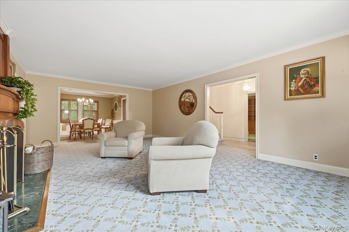 88 Luquer Road Manhasset, NY 11030 - Photo 8 of 38 a living room with furniture and a flat screen tv