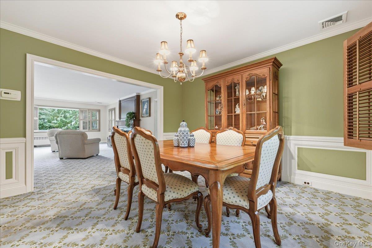 88 Luquer Road Manhasset, NY 11030 - Photo 10 of 38 a view of a dining room with furniture window and wooden floor