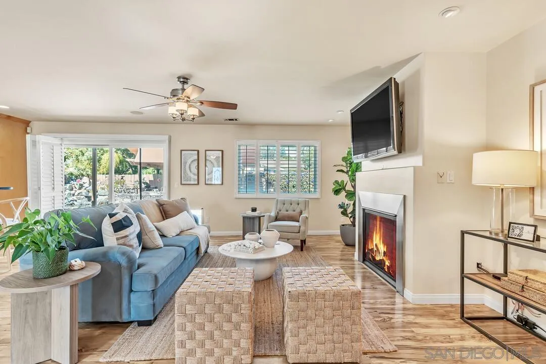 14228 Frame Road Poway, CA 92064 - Photo 1 of 49 a living room with furniture a flat screen tv and a fireplace