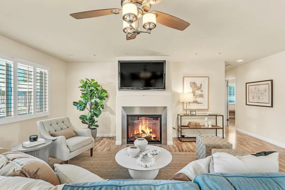 14228 Frame Road Poway, CA 92064 - Photo 14 of 49 a living room with furniture a fireplace and a flat screen tv