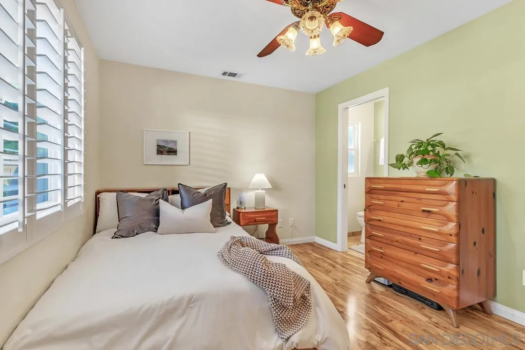 14228 Frame Road Poway, CA 92064 - Photo 16 of 49 a bedroom with a bed and wooden floor