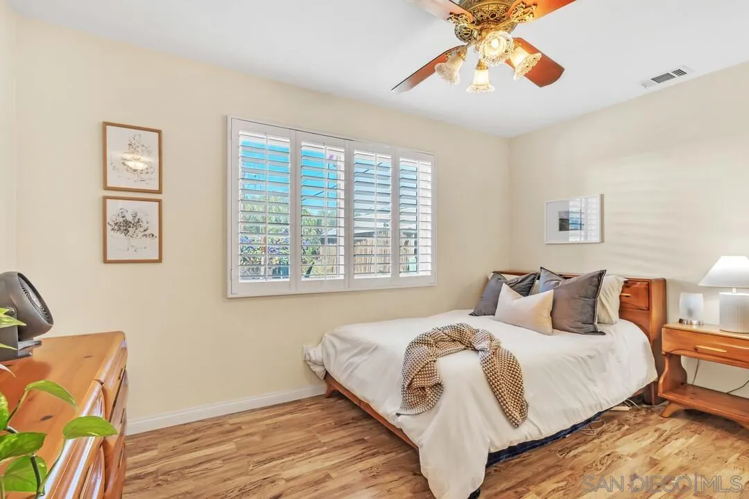 14228 Frame Road Poway, CA 92064 - Photo 17 of 49 a bedroom with bed and a window