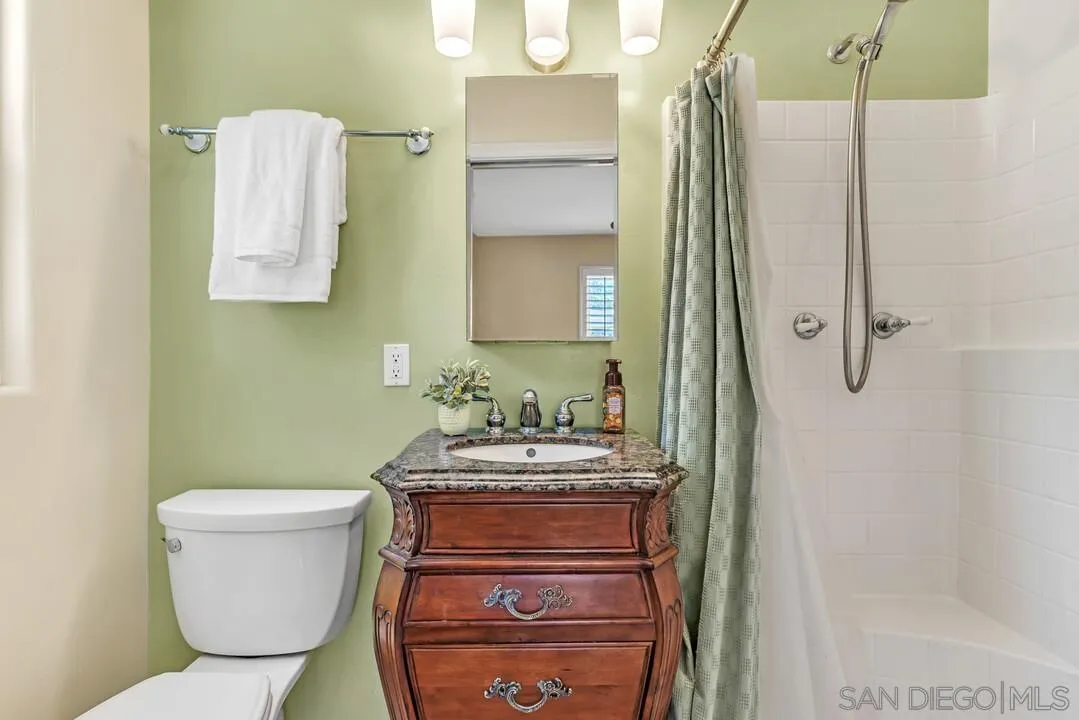 14228 Frame Road Poway, CA 92064 - Photo 18 of 49 a bathroom with a sink a toilet and shower