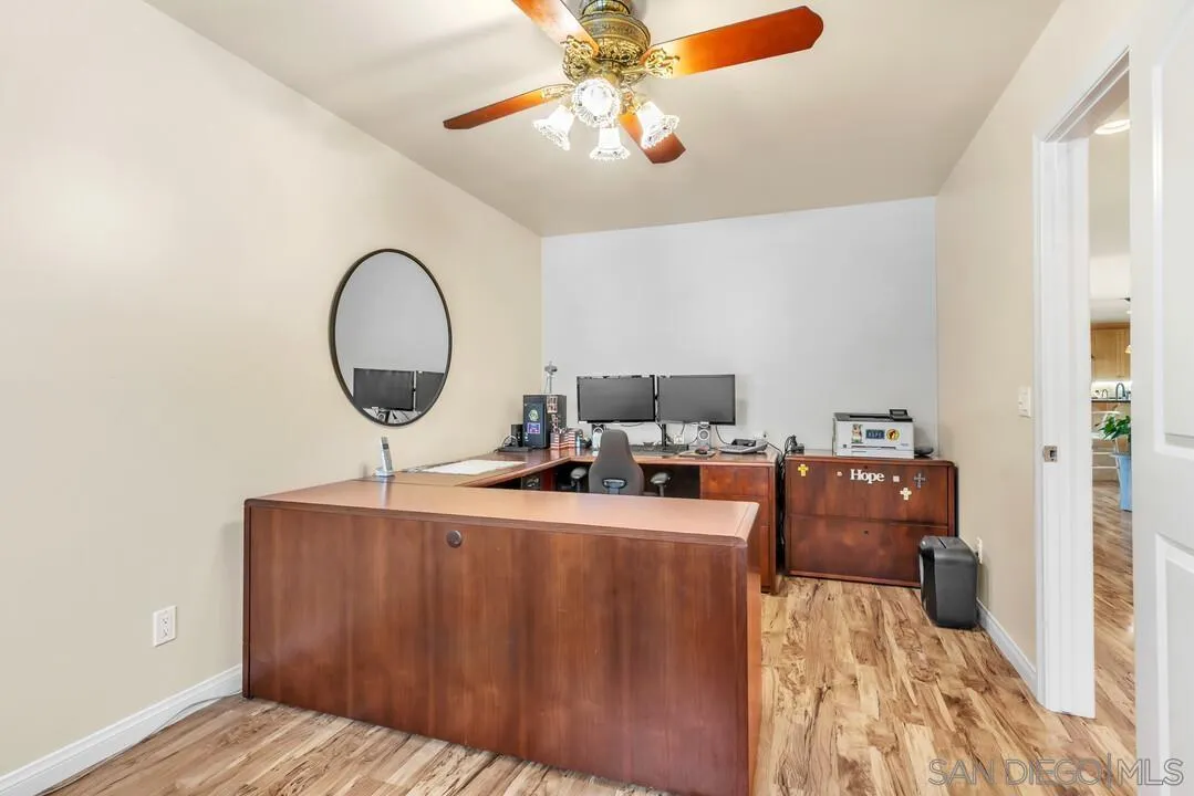 14228 Frame Road Poway, CA 92064 - Photo 19 of 49 a living room with a couch and a chandelier