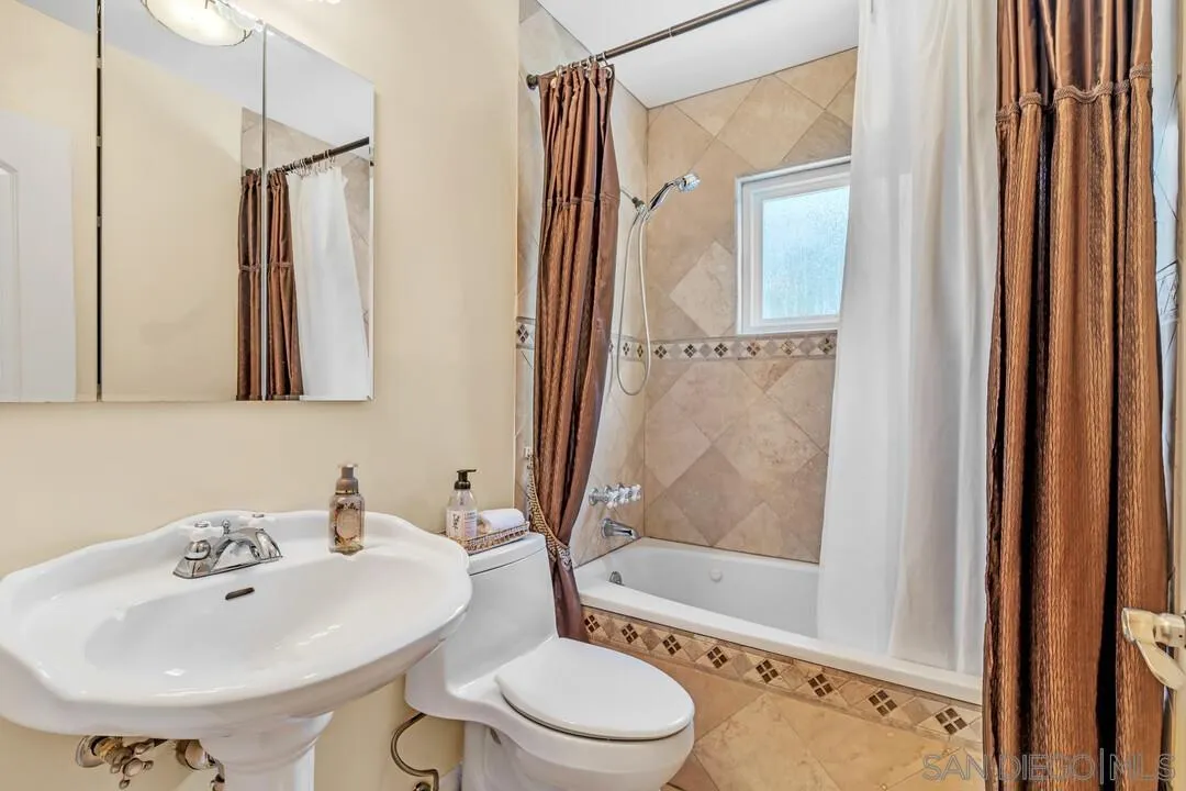 14228 Frame Road Poway, CA 92064 - Photo 21 of 49 a bathroom with a sink toilet and shower