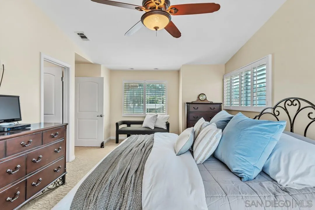 14228 Frame Road Poway, CA 92064 - Photo 22 of 49 a bedroom with a bed a couch and dresser