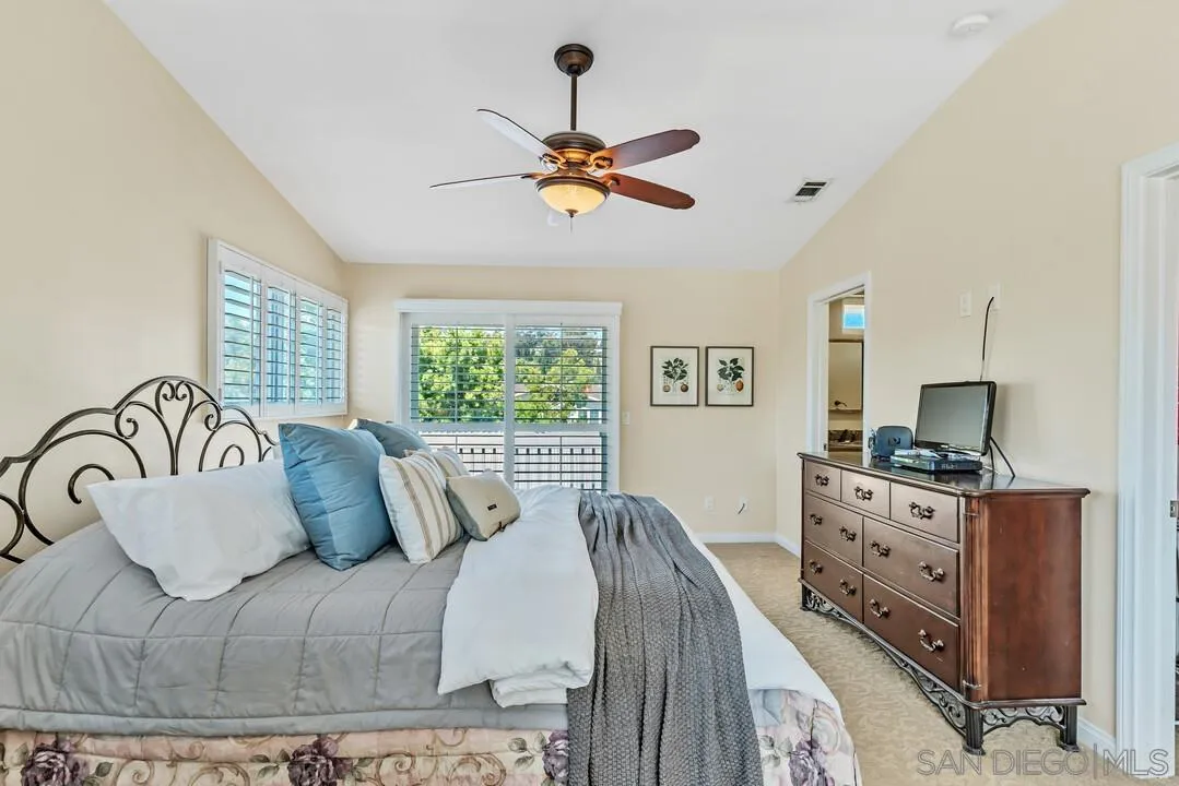 14228 Frame Road Poway, CA 92064 - Photo 23 of 49 a bedroom with a bed and a flat screen tv
