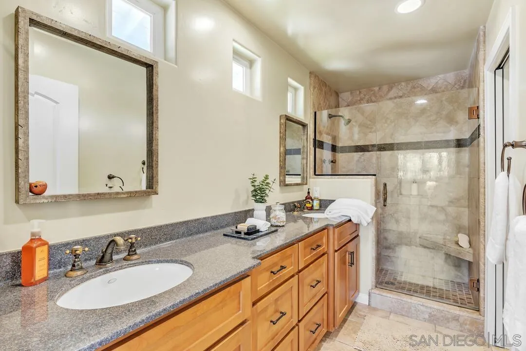 14228 Frame Road Poway, CA 92064 - Photo 24 of 49 a bathroom with a granite countertop sink mirror and double