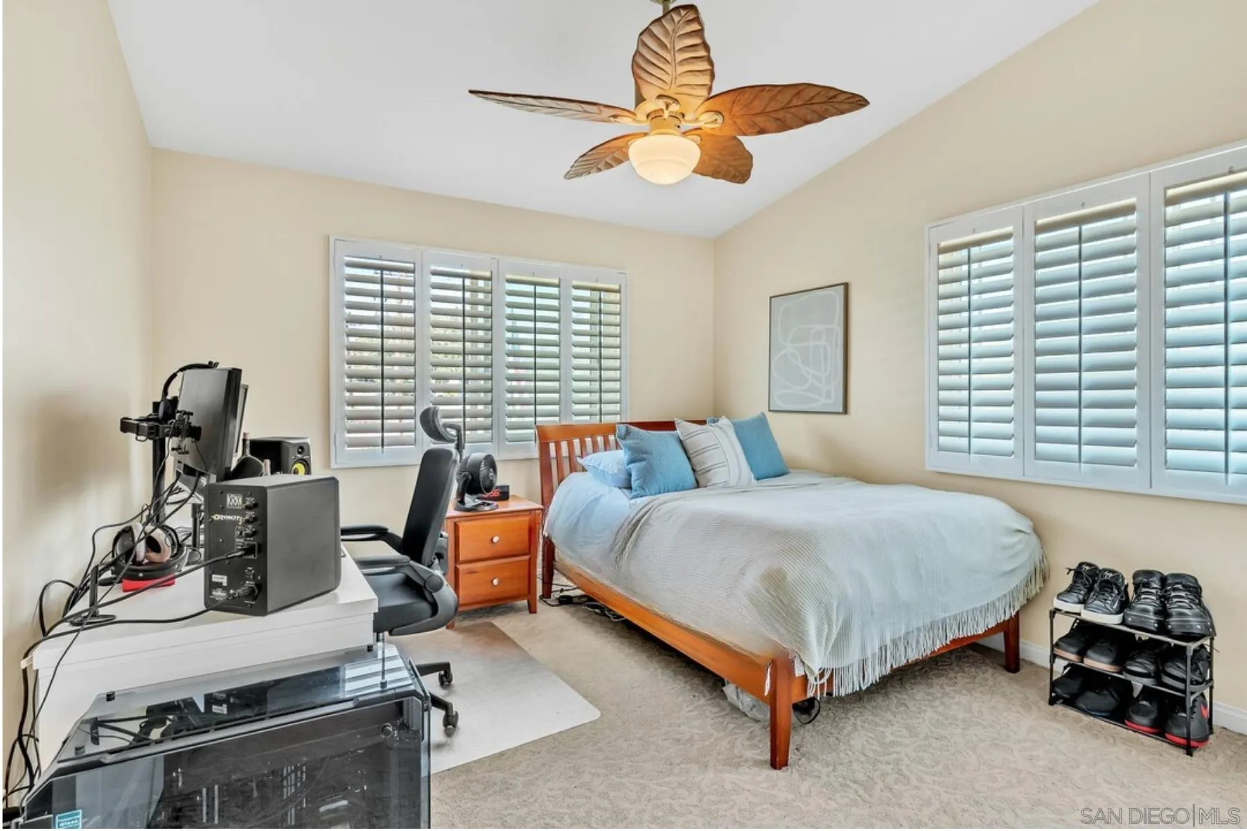 14228 Frame Road Poway, CA 92064 - Photo 27 of 49 a bedroom with a bed and a chandelier