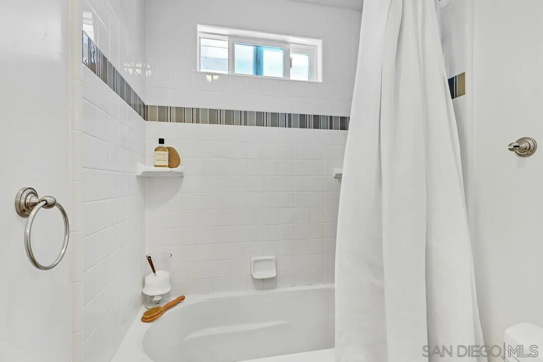 14228 Frame Road Poway, CA 92064 - Photo 30 of 49 a bathroom with a bathtub and a shower