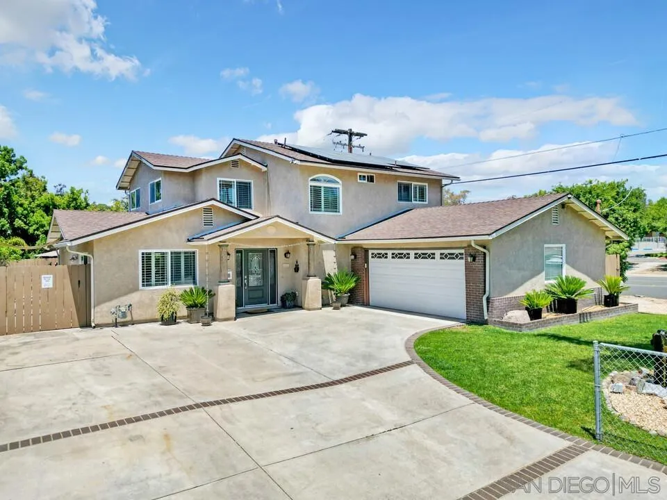 14228 Frame Road Poway, CA 92064 - Photo 36 of 49 a front view of a house with a yard and garage
