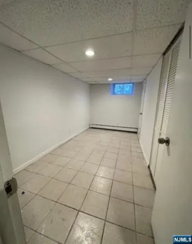 a view of a livingroom with an empty space and a rug