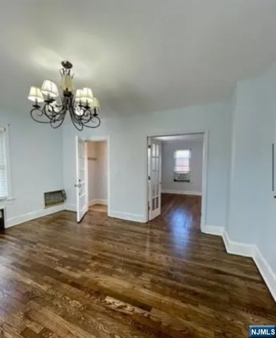 a view of an room with wooden floor