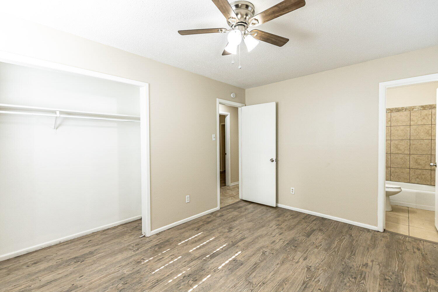 1916 71st Street Lubbock, TX 79412 - Photo 5 of 10 a view of an empty room with wooden floor