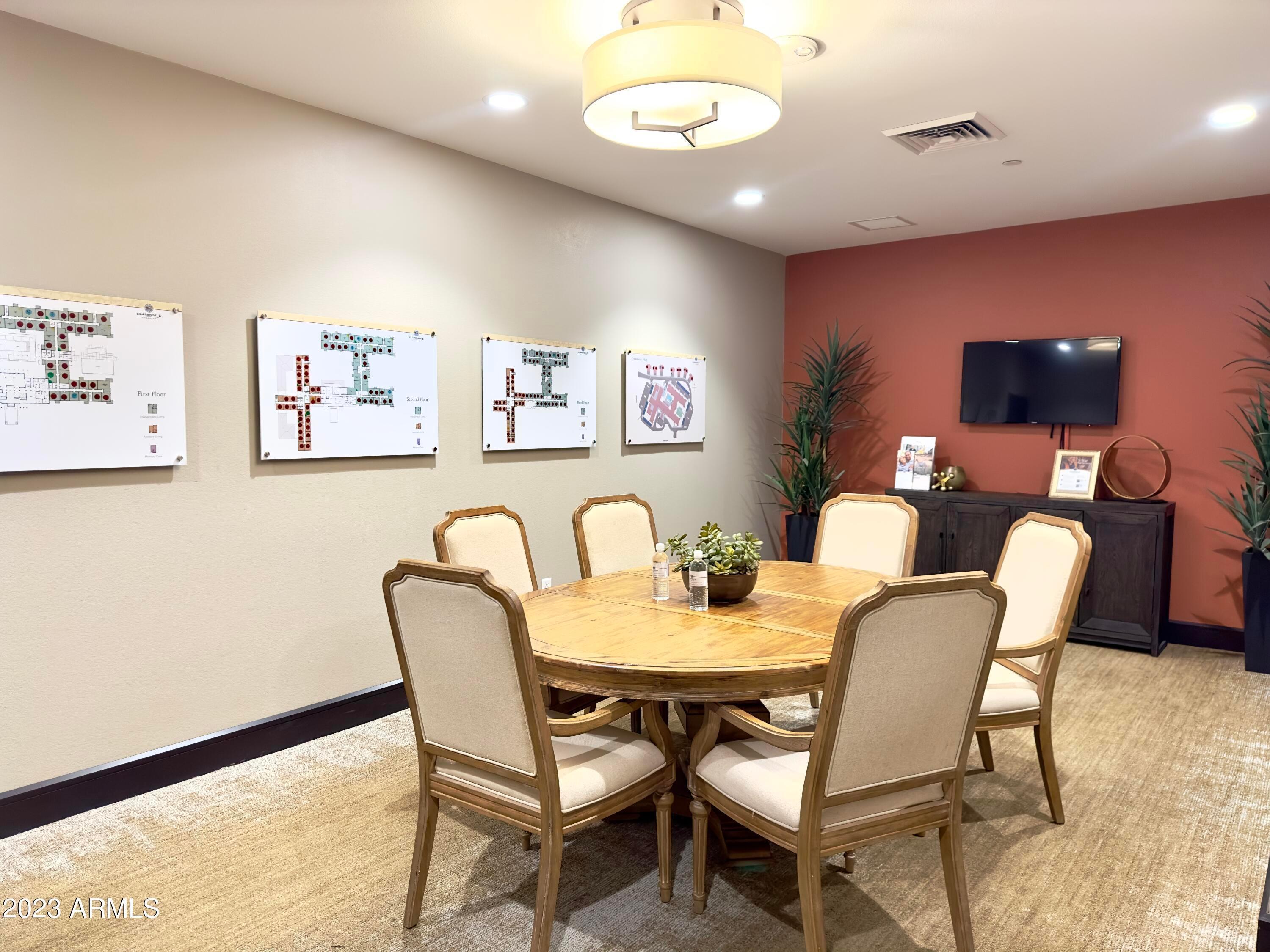 5900 South Gilbert Road Chandler, AZ 85249 - Photo 4 of 12 a dining room with furniture and a flat screen tv