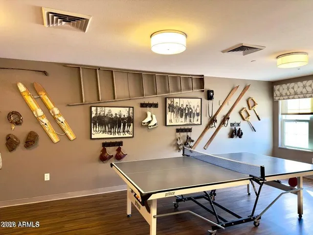 a room with lots of furniture and windows