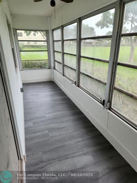 211 Mansfield East, Unit 211 Boca Raton, FL 33434 - Photo 9 of 14 a view of an empty room with a window