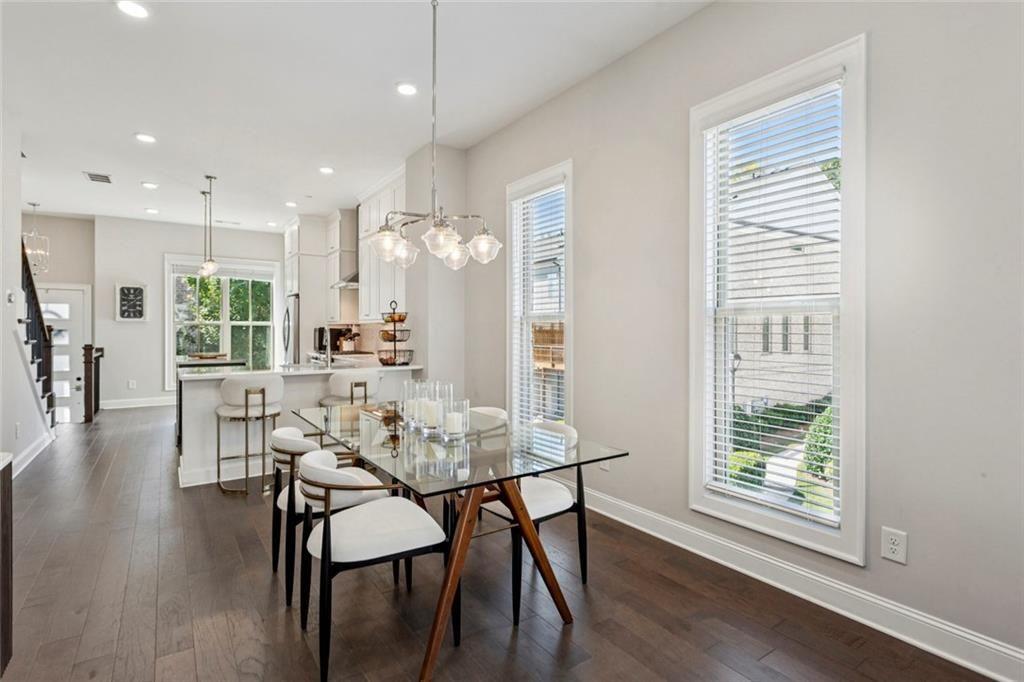 4219 Deming Circle Sandy Springs, GA 30342 - Photo 11 of 43 a view of a dining room with furniture and wooden floor