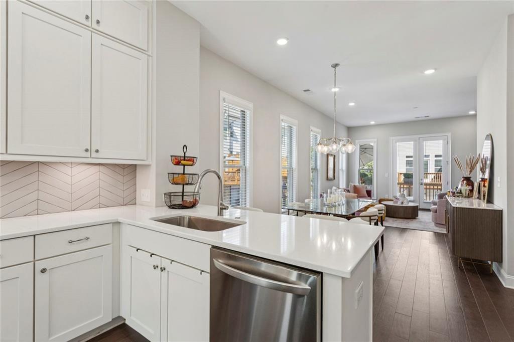 4219 Deming Circle Sandy Springs, GA 30342 - Photo 17 of 43 a kitchen with sink refrigerator and cabinets