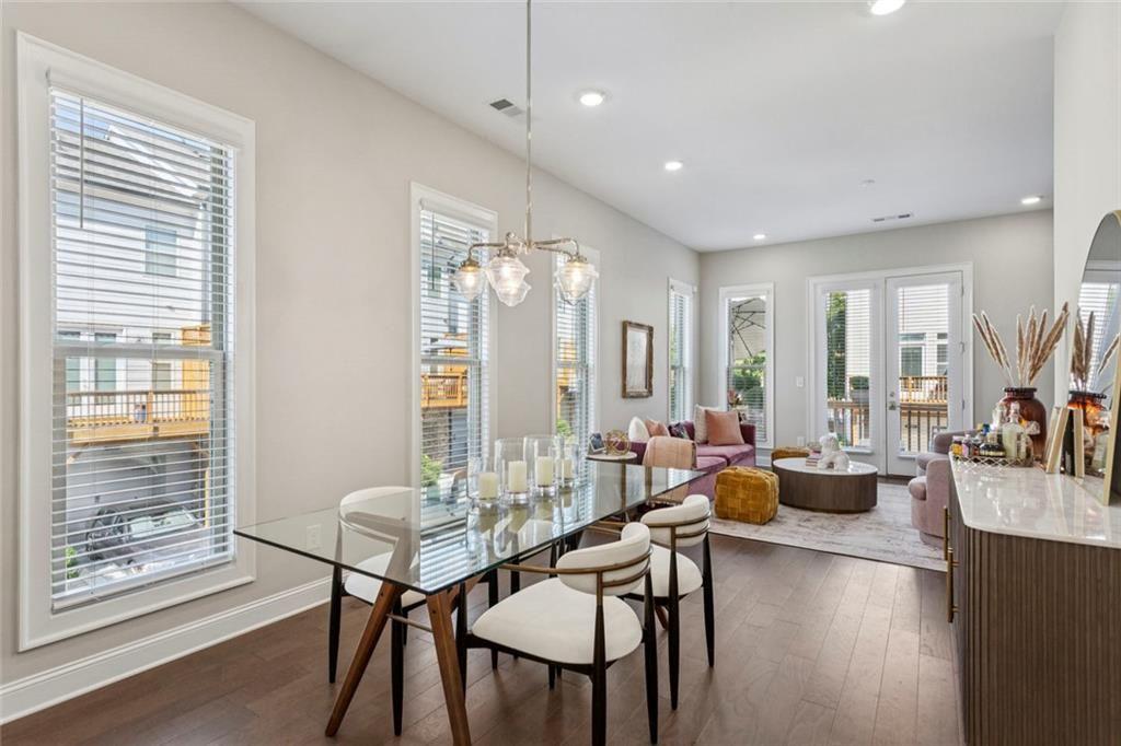 4219 Deming Circle Sandy Springs, GA 30342 - Photo 19 of 43 a view of a dining room with furniture and wooden floor