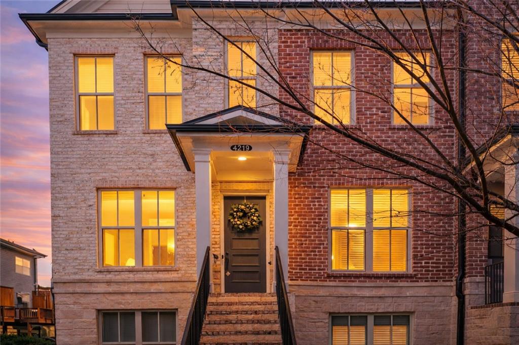 4219 Deming Circle Sandy Springs, GA 30342 - Photo 2 of 43 a view of a brick house with a large windows