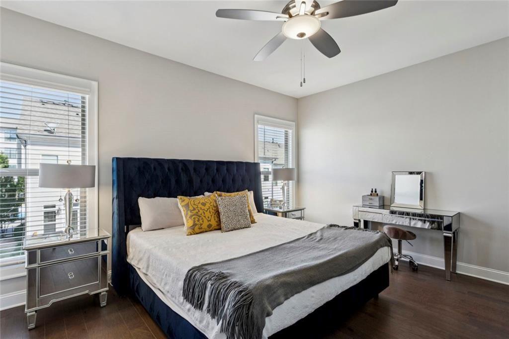 4219 Deming Circle Sandy Springs, GA 30342 - Photo 27 of 43 a bedroom with a bed and a chandelier