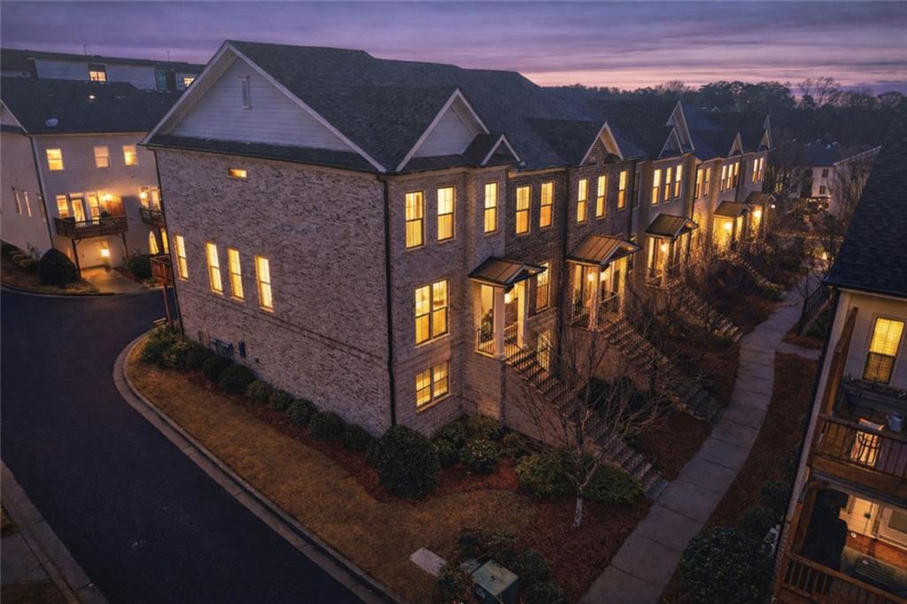 4219 Deming Circle Sandy Springs, GA 30342 - Photo 3 of 43 a front view of a house with a yard