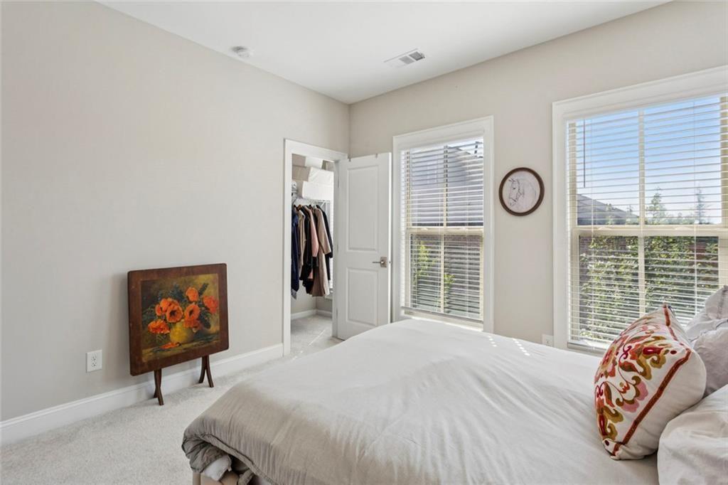 4219 Deming Circle Sandy Springs, GA 30342 - Photo 35 of 43 a bedroom with a bed and a window