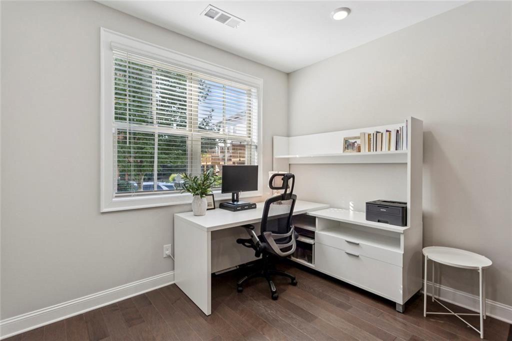 4219 Deming Circle Sandy Springs, GA 30342 - Photo 38 of 43 a view of a workspace with furniture and a window