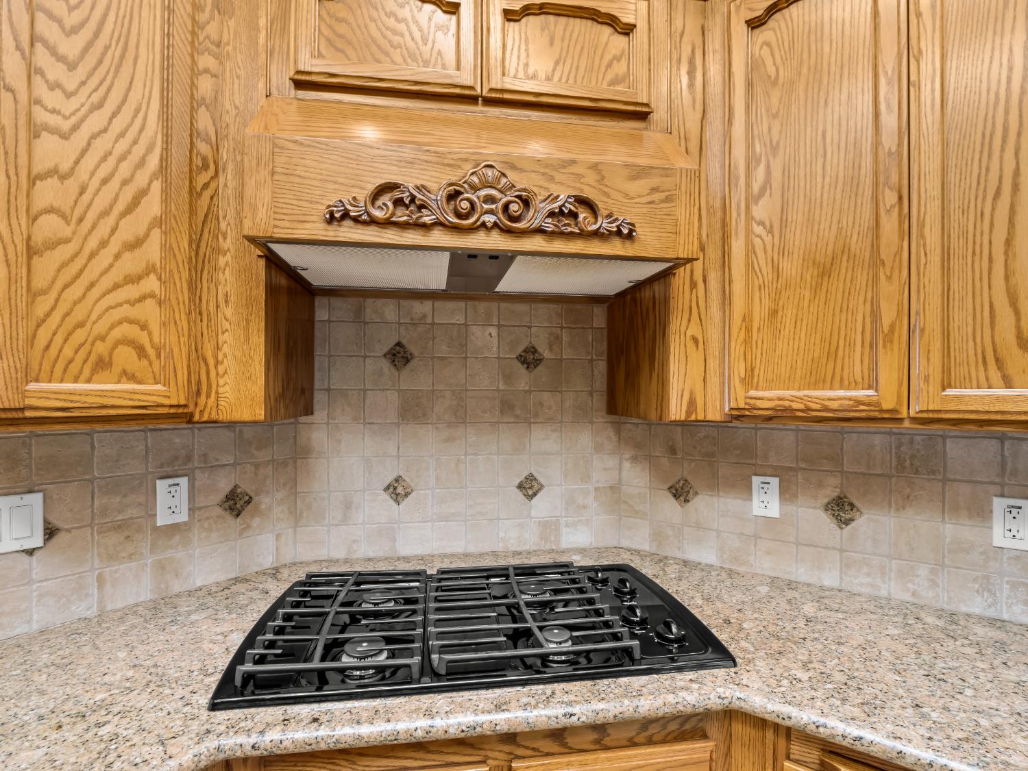 16389 Monreal Road Madera, CA 93636 - Photo 13 of 52 a stove top oven sitting inside of a kitchen