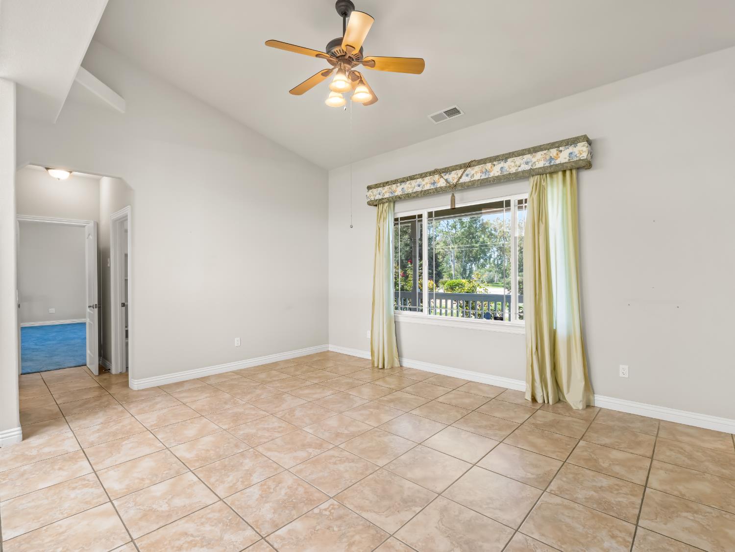 16389 Monreal Road Madera, CA 93636 - Photo 15 of 52 a view of an empty room with a window