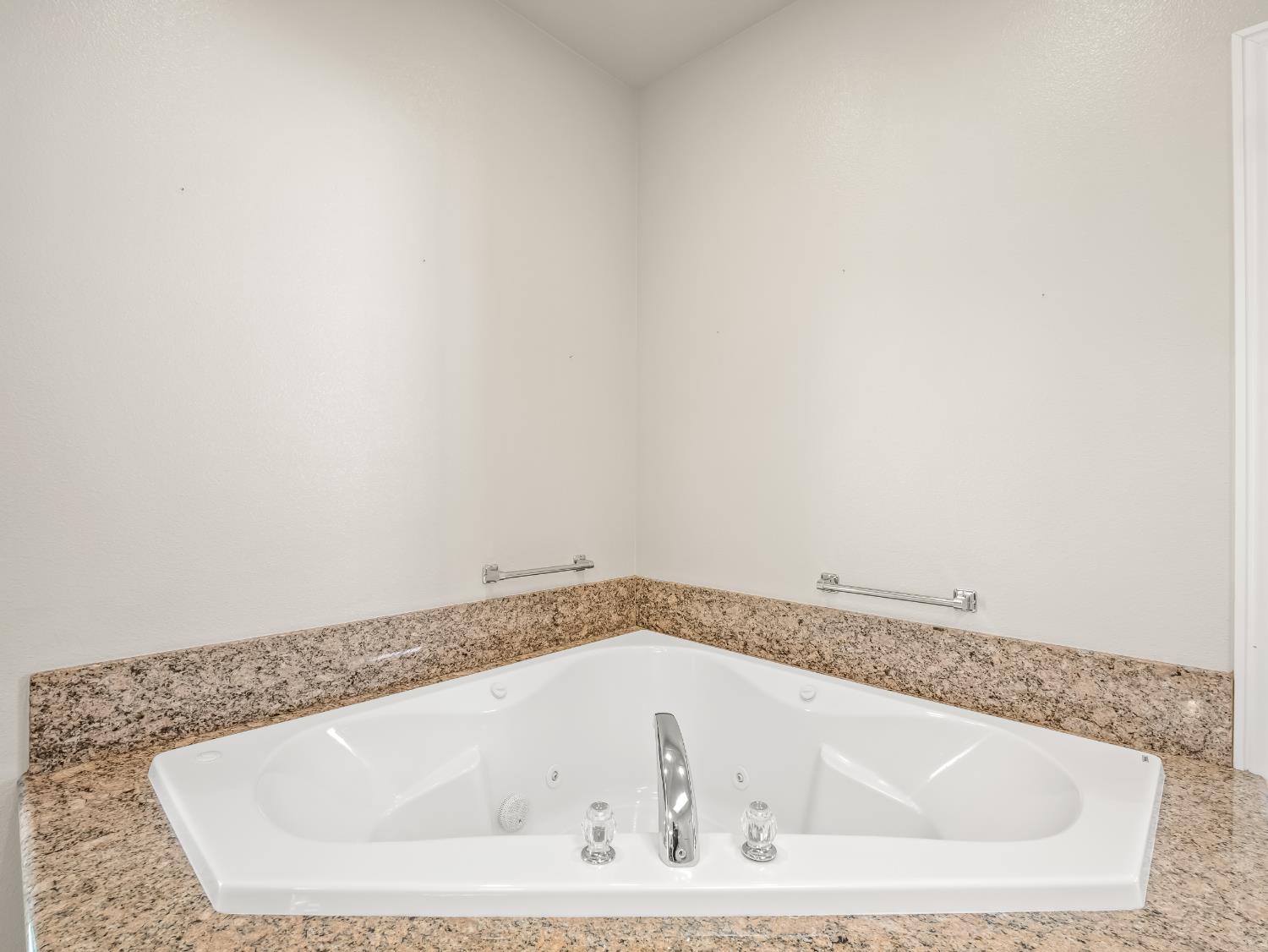 16389 Monreal Road Madera, CA 93636 - Photo 23 of 52 a close view of a bathtub in a bathroom