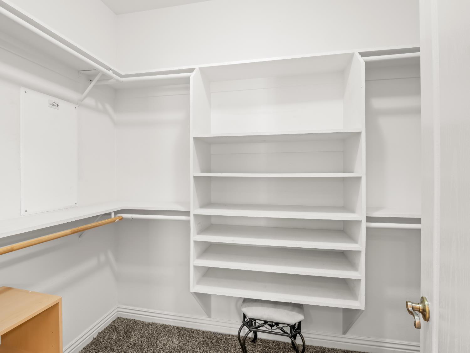 16389 Monreal Road Madera, CA 93636 - Photo 24 of 52 a view of an empty walk in closet