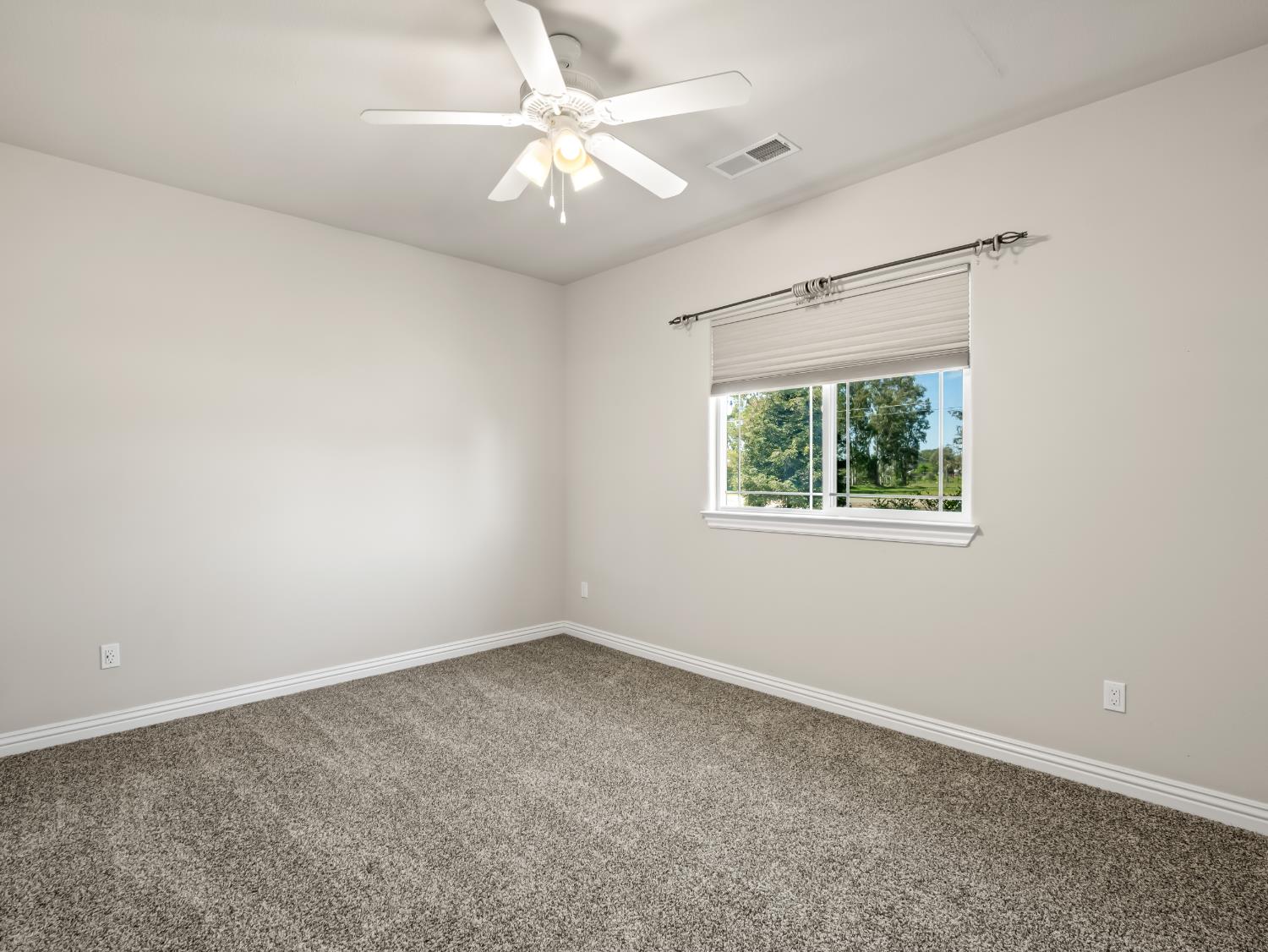 16389 Monreal Road Madera, CA 93636 - Photo 26 of 52 an empty room with a window