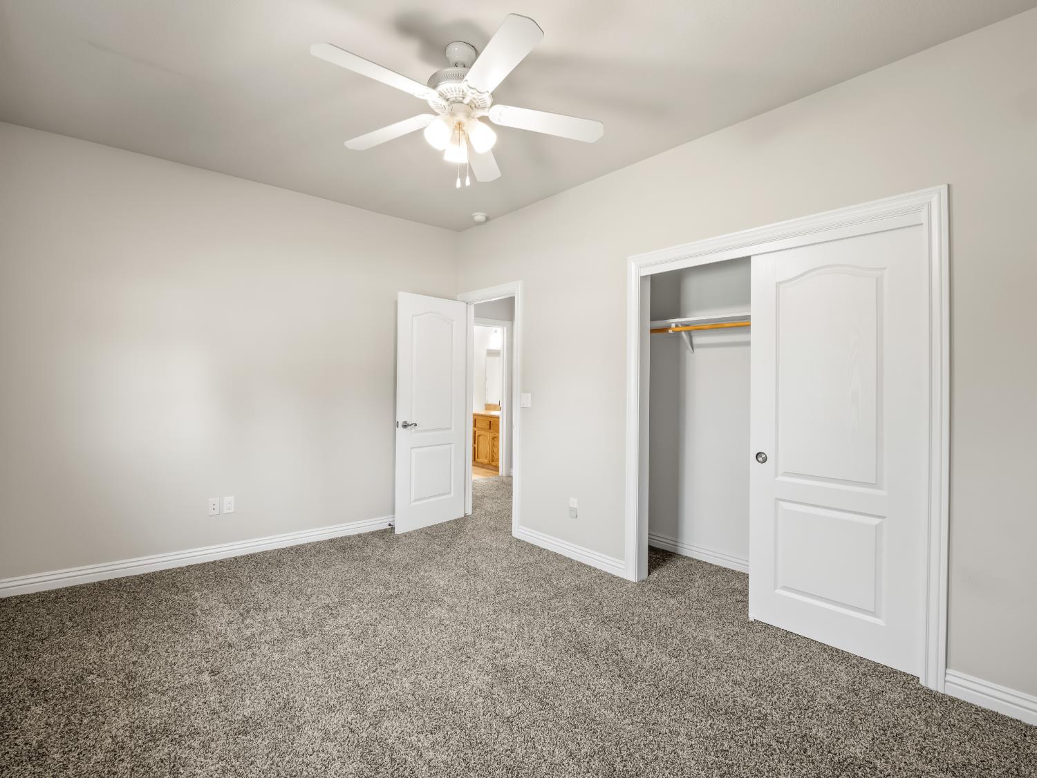 16389 Monreal Road Madera, CA 93636 - Photo 27 of 52 an empty room with chandelier fan
