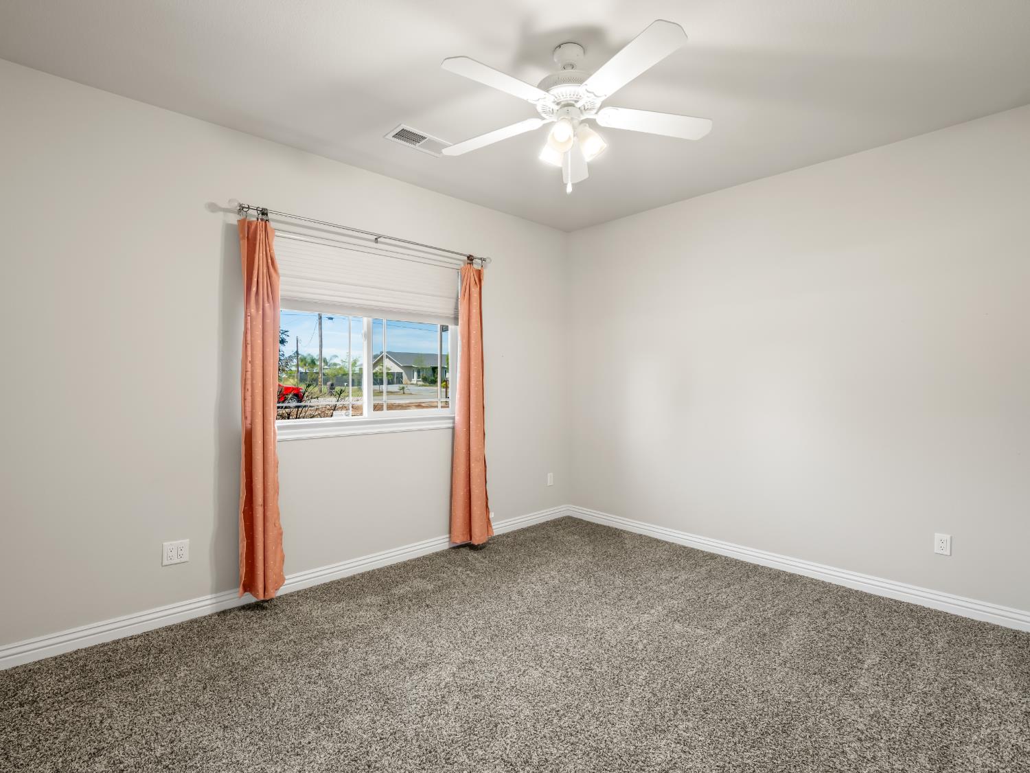16389 Monreal Road Madera, CA 93636 - Photo 28 of 52 an empty room with a window