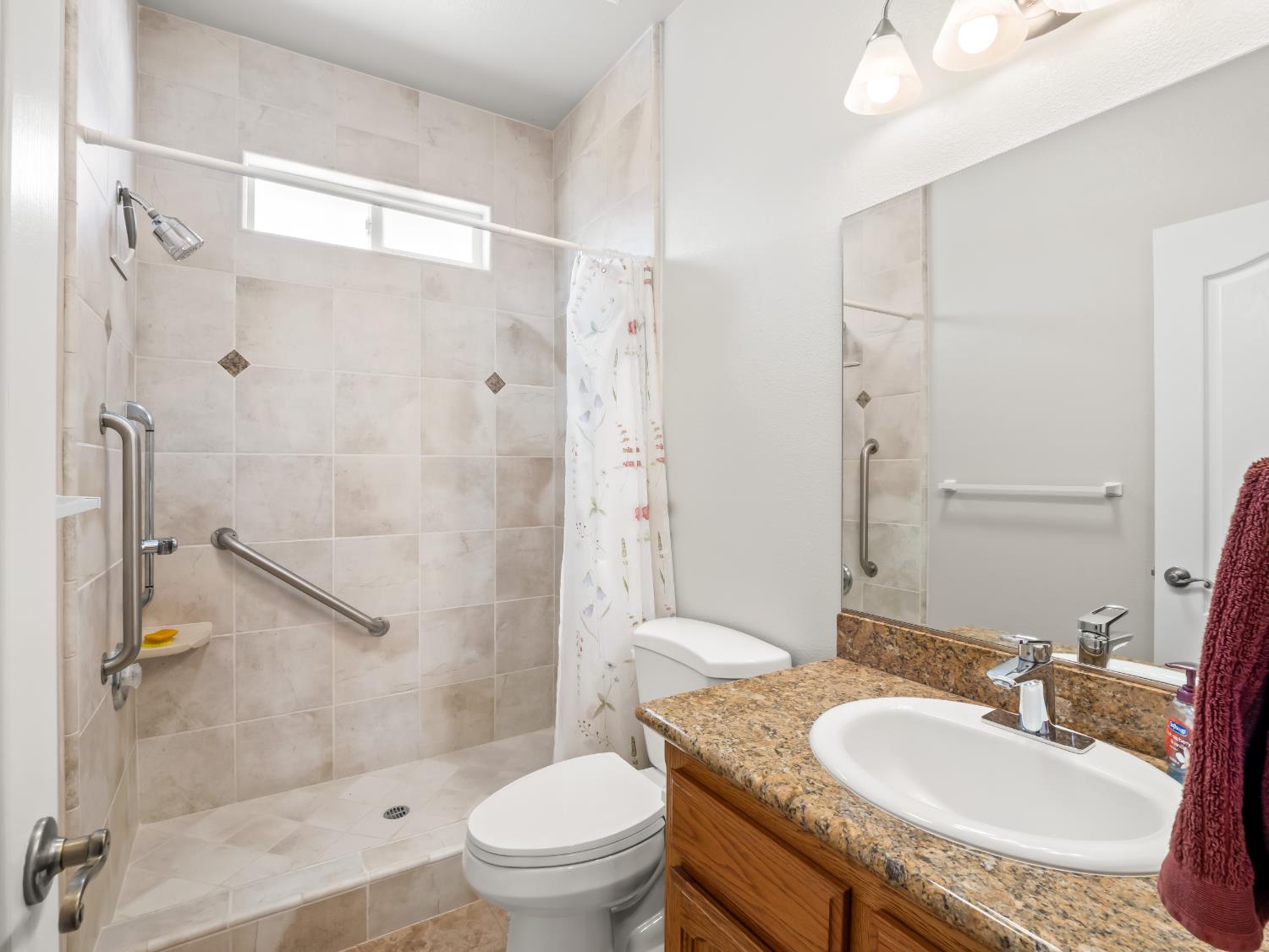 16389 Monreal Road Madera, CA 93636 - Photo 36 of 52 a bathroom with a granite countertop sink toilet and shower