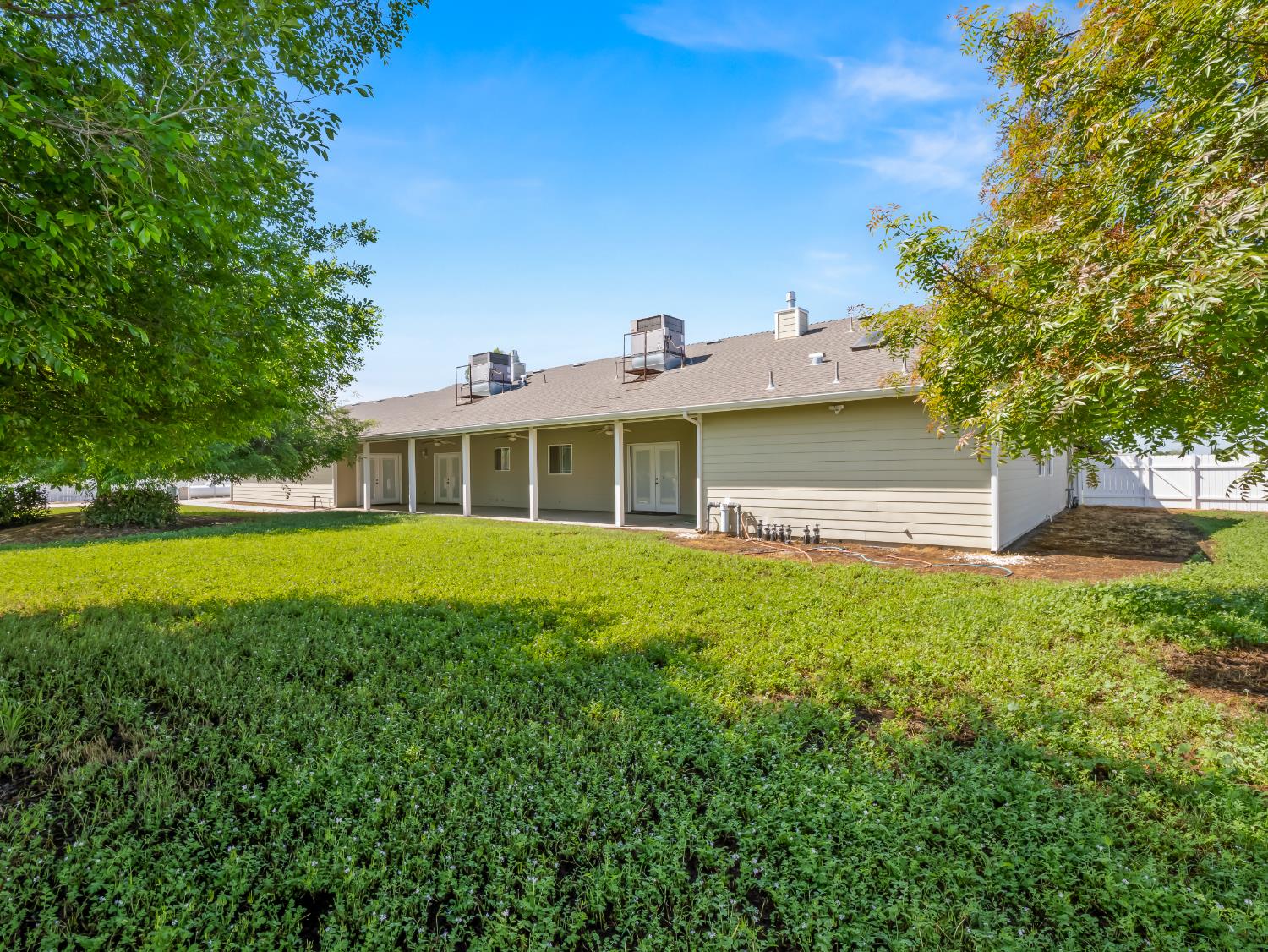 16389 Monreal Road Madera, CA 93636 - Photo 44 of 52 a front view of a house with a yard