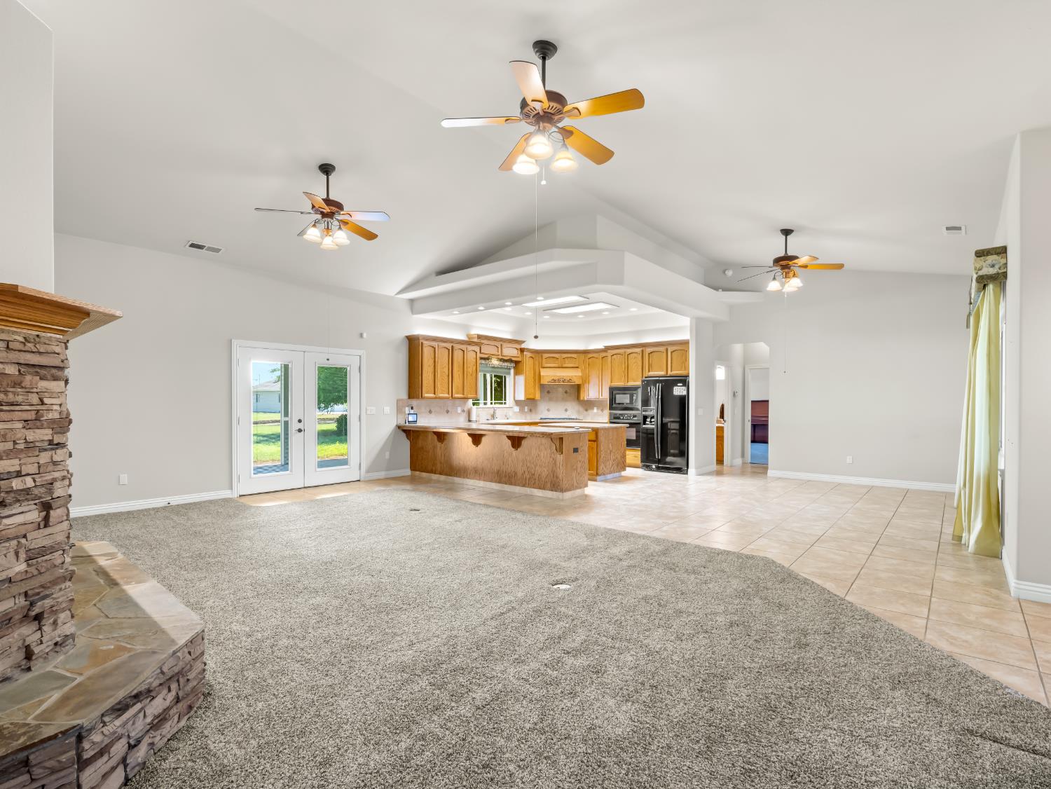 16389 Monreal Road Madera, CA 93636 - Photo 6 of 52 a view of an empty room with a window