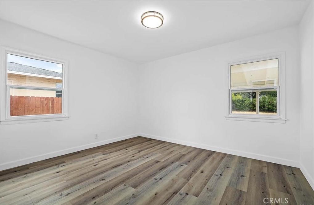 100 Eastern Pasadena, CA 91107 - Photo 13 of 18 an empty room with wooden floor and windows